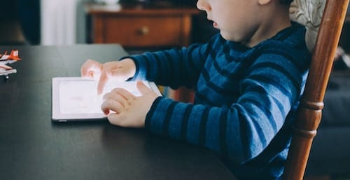 image of child learning on a mobile device